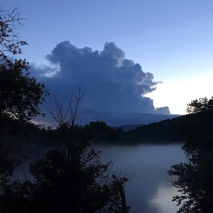 photo of clouds over a stream